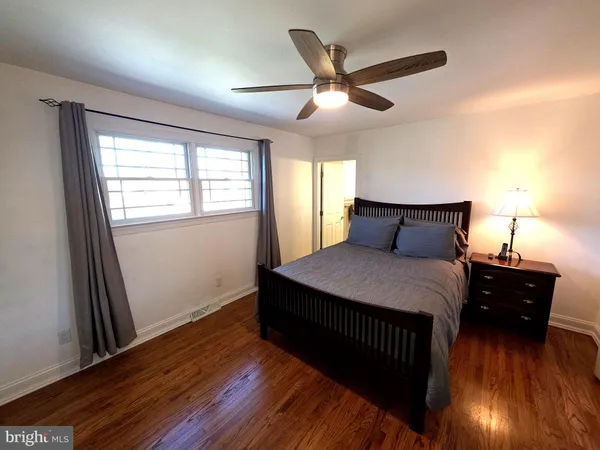 a bedroom with a bed and a bathroom
