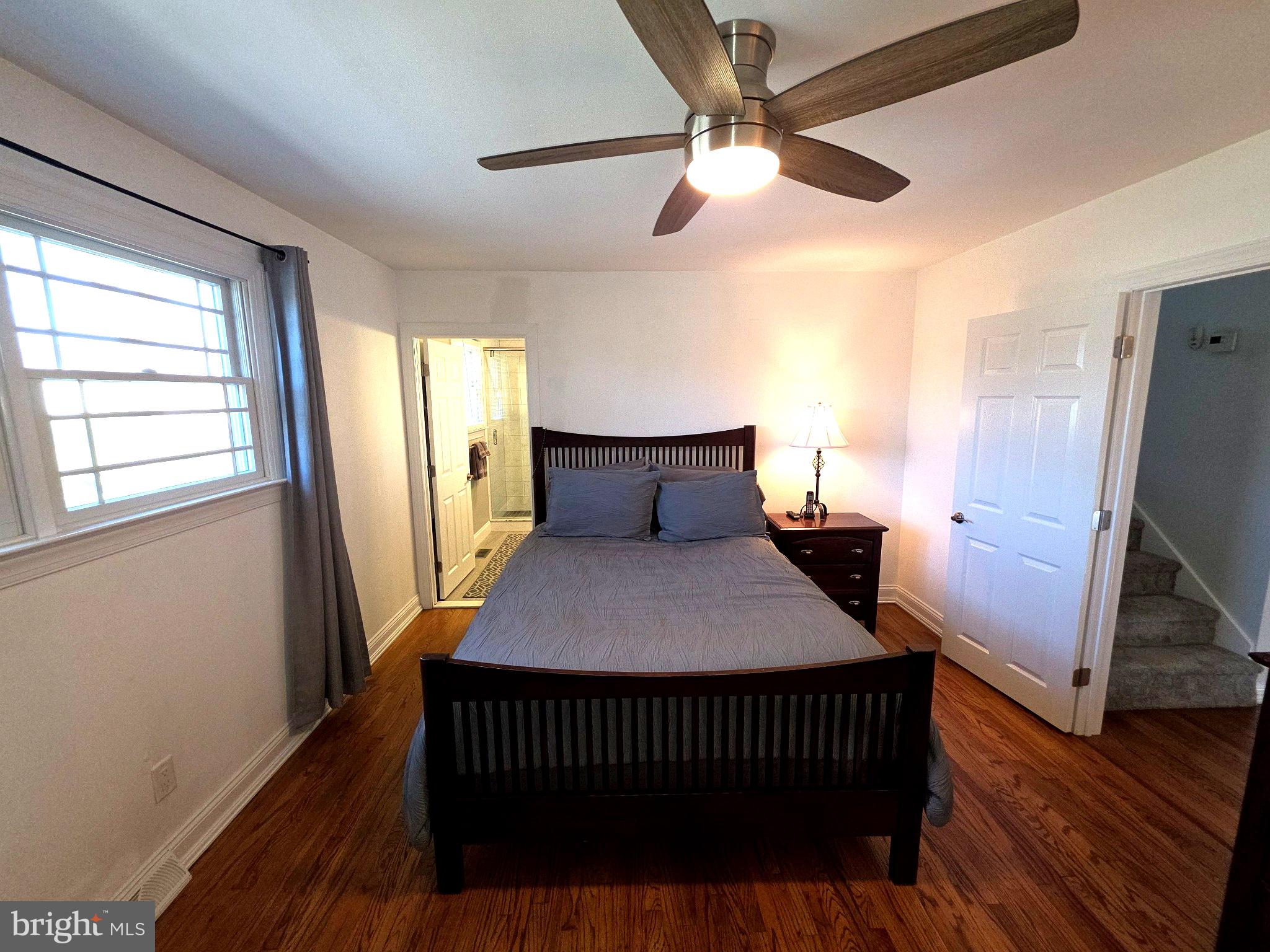 156 Crockett Road Warminster, PA 18974 - Photo 31 of 57 a bedroom with a bed and wooden floor