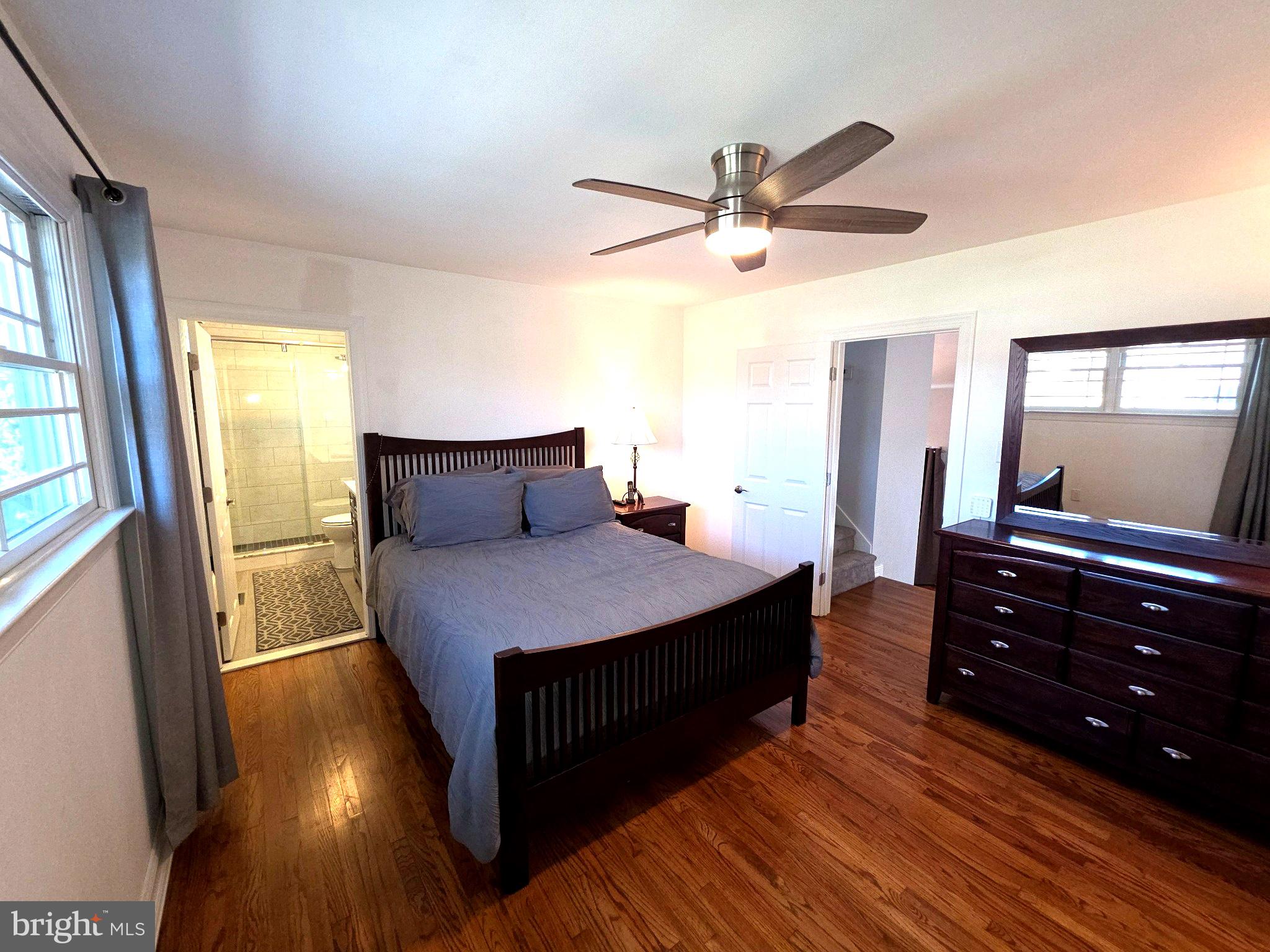 156 Crockett Road Warminster, PA 18974 - Photo 32 of 57 a bedroom with a bed and wooden floor