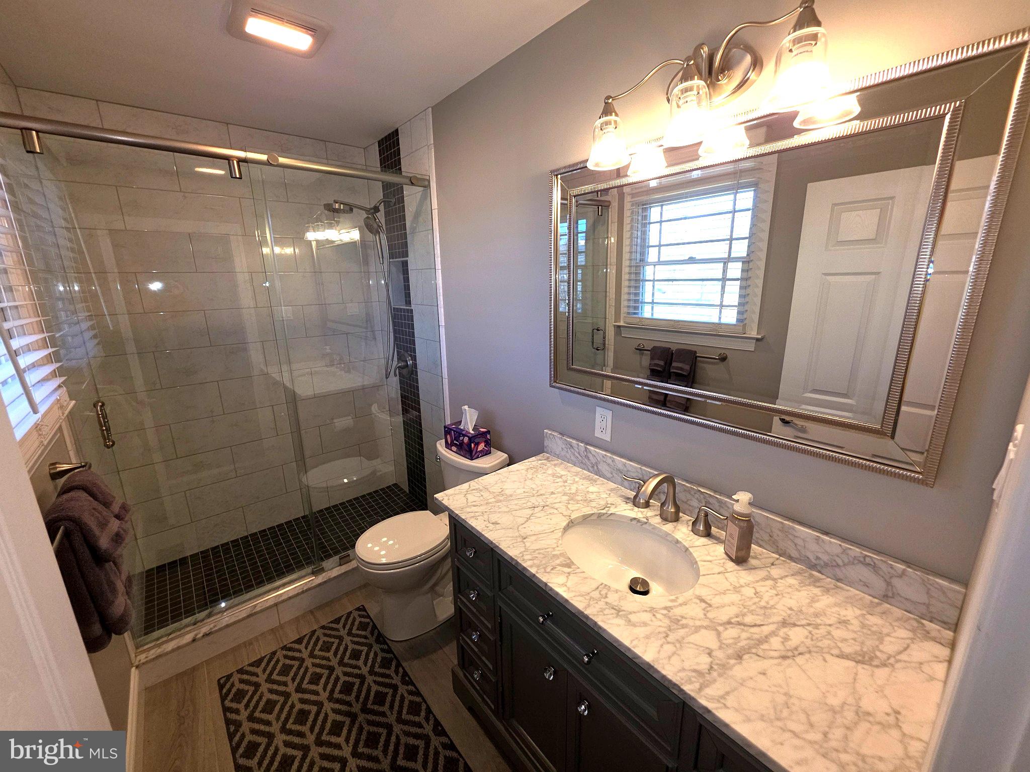 156 Crockett Road Warminster, PA 18974 - Photo 34 of 57 a bathroom with a granite countertop sink toilet and shower