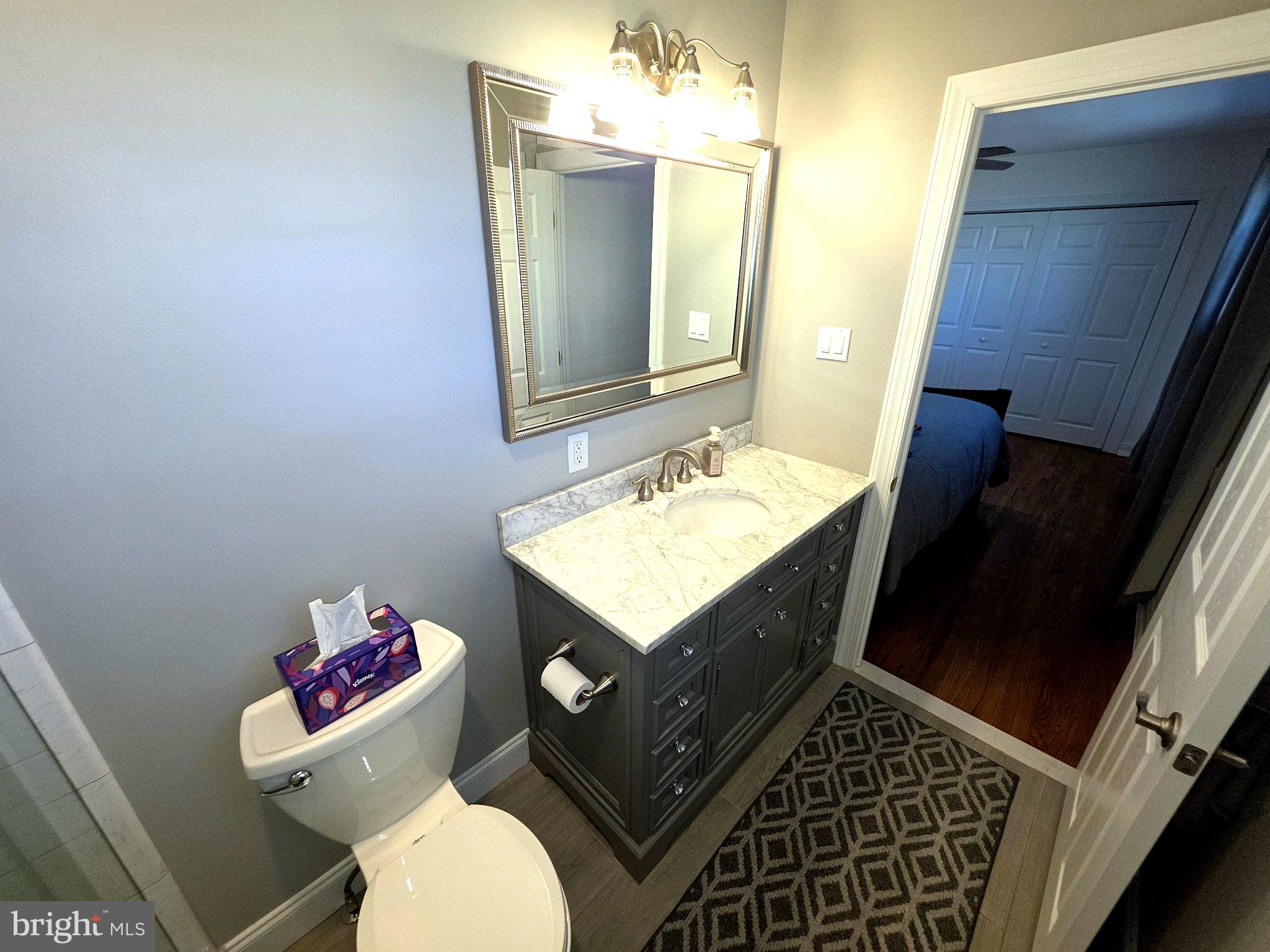 156 Crockett Road Warminster, PA 18974 - Photo 36 of 57 a bathroom with a sink toilet vanity and mirror