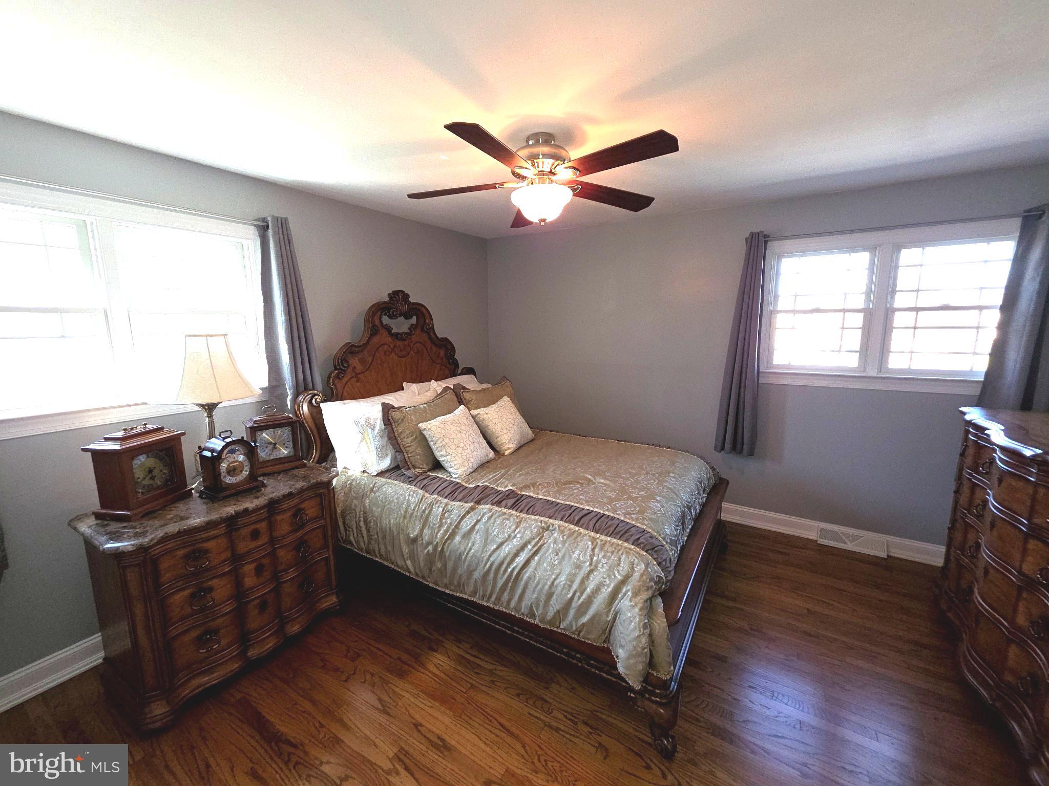 156 Crockett Road Warminster, PA 18974 - Photo 37 of 57 a bedroom with a bed and wooden floor