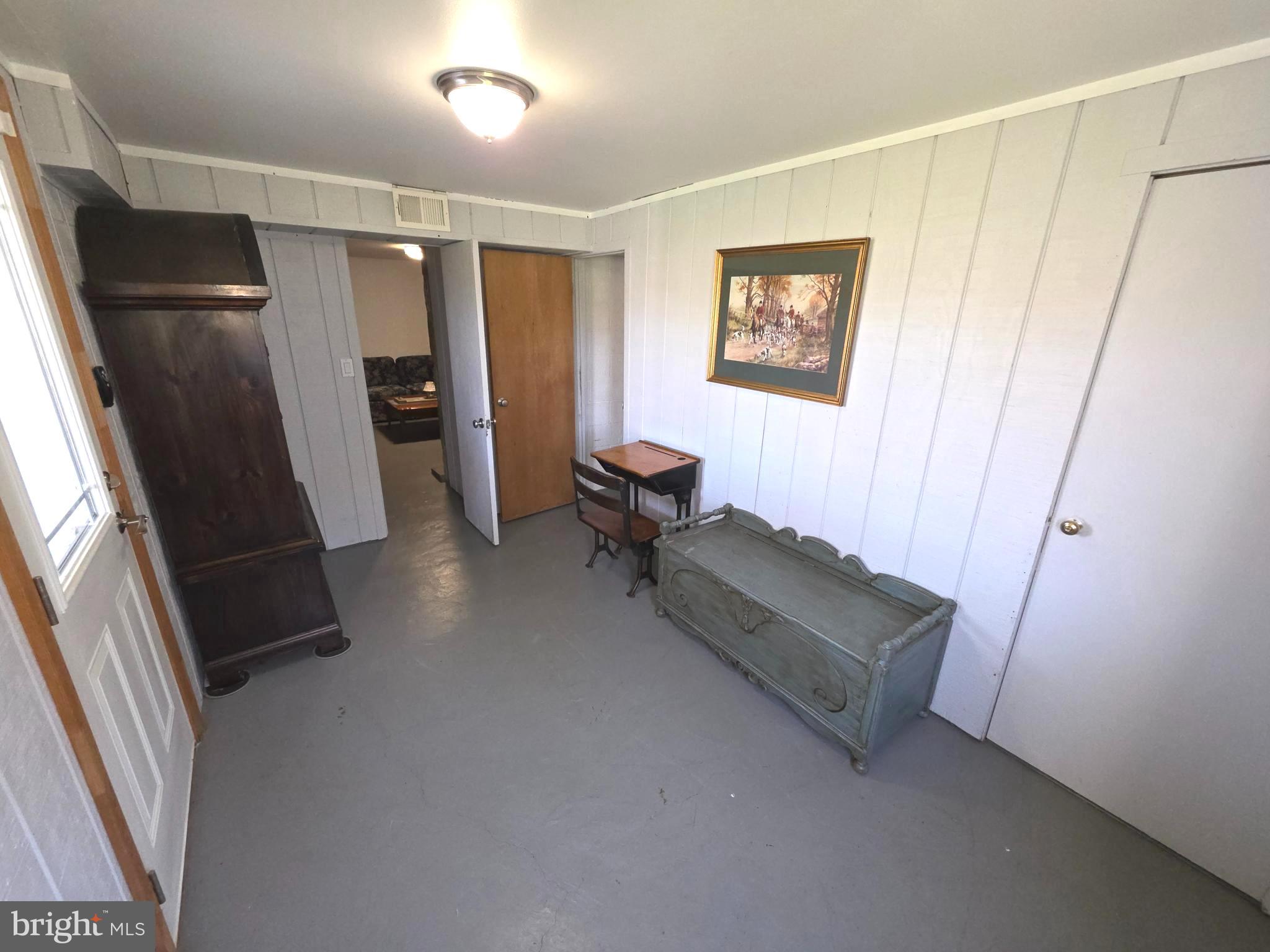 156 Crockett Road Warminster, PA 18974 - Photo 55 of 57 a living room with furniture and a refrigerator