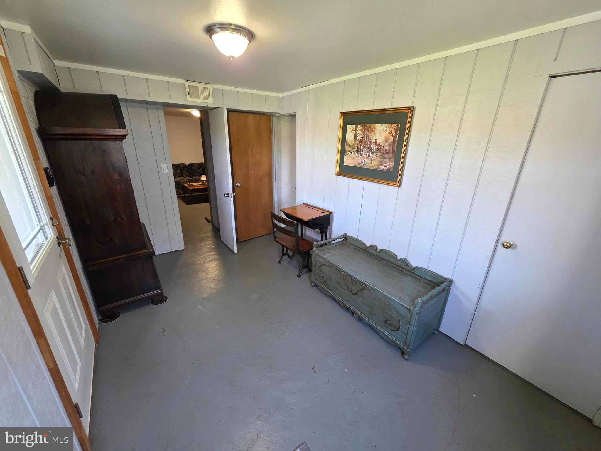 156 Crockett Road Warminster, PA 18974 - Photo 56 of 57 a living room with closet and a refrigerator