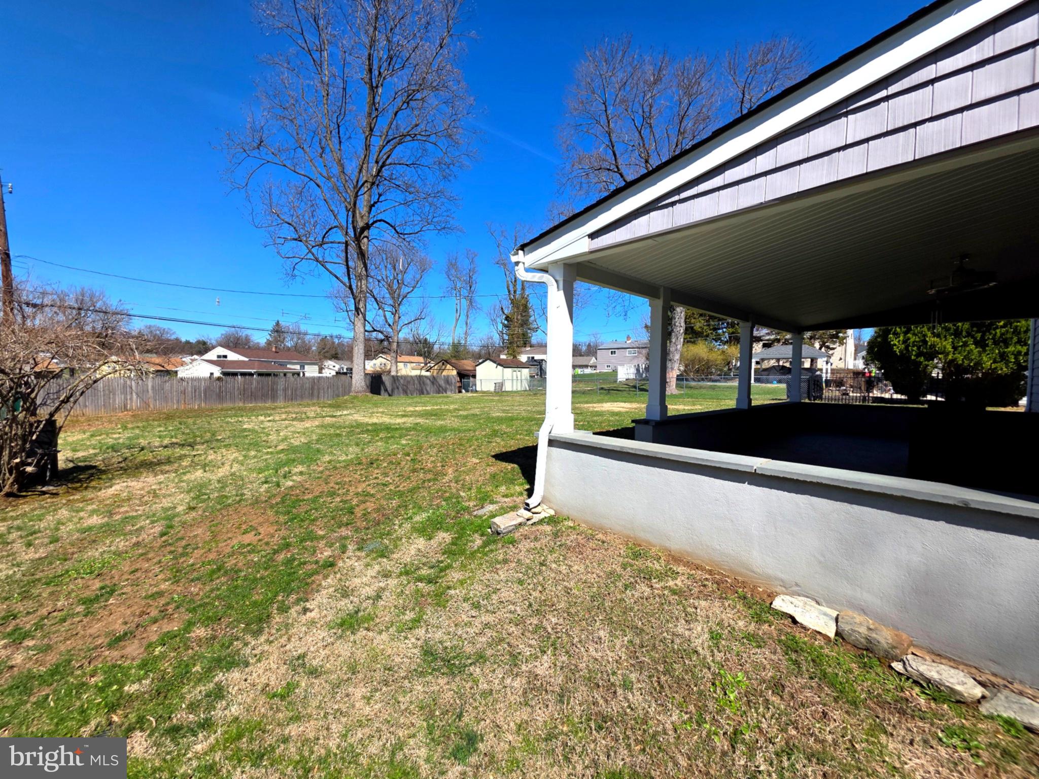 156 Crockett Road Warminster, PA 18974 - Photo 7 of 57 a view of a patio with a table and chairs under an umbrella