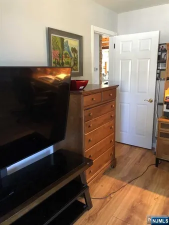 a room with a closet and a mirror