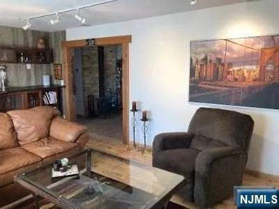 a living room with furniture and a rug