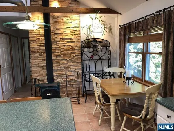 a dining room with furniture and window