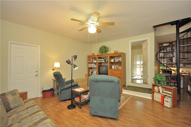 60 Fairview School Road Normandy, TN 37360 - Photo 8 of 20 SITTING AREA WITH VIEW OF SPIRAL STAIRCASE LEADING TO SECOND LEVEL