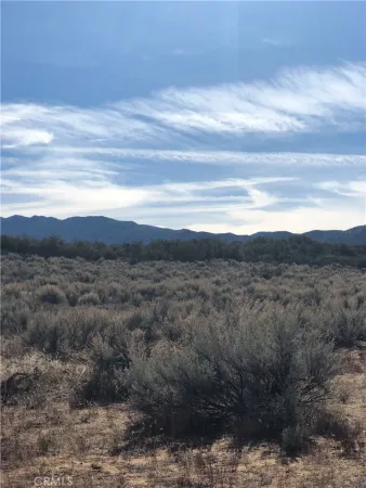 a view of mountain with sunset