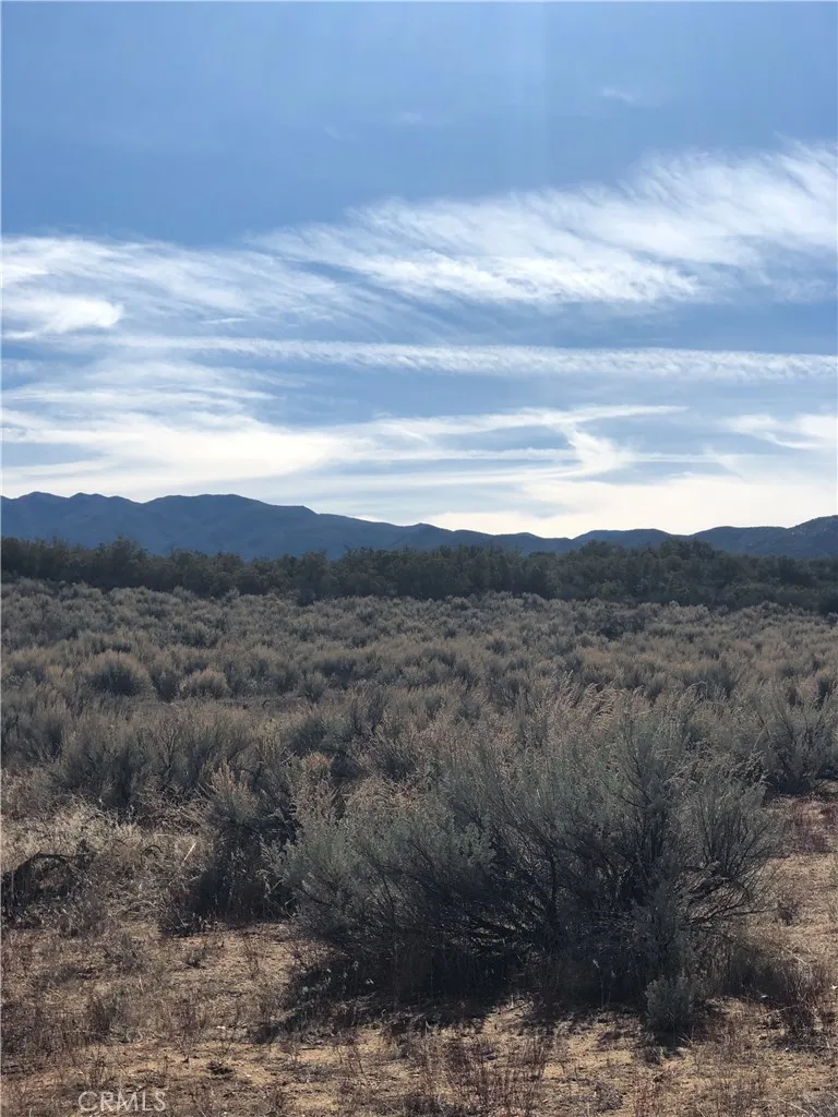 a view of mountain with sunset