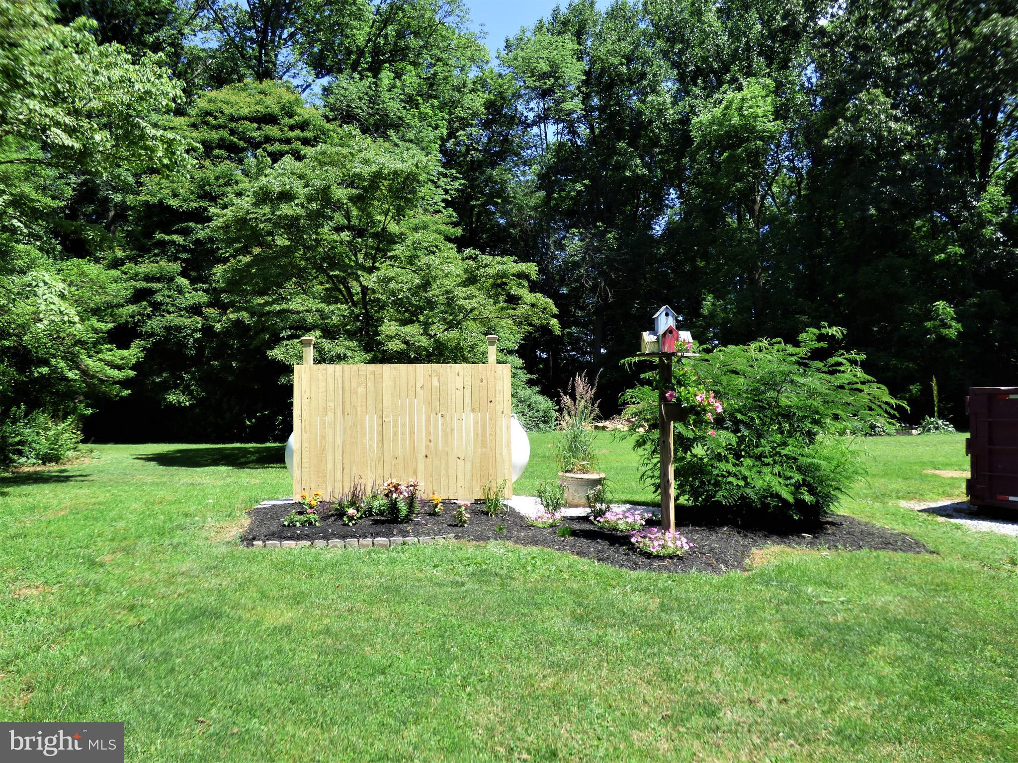 235 Reid Road Coatesville, PA 19320 - Photo 29 of 32 View of Back - flower garden