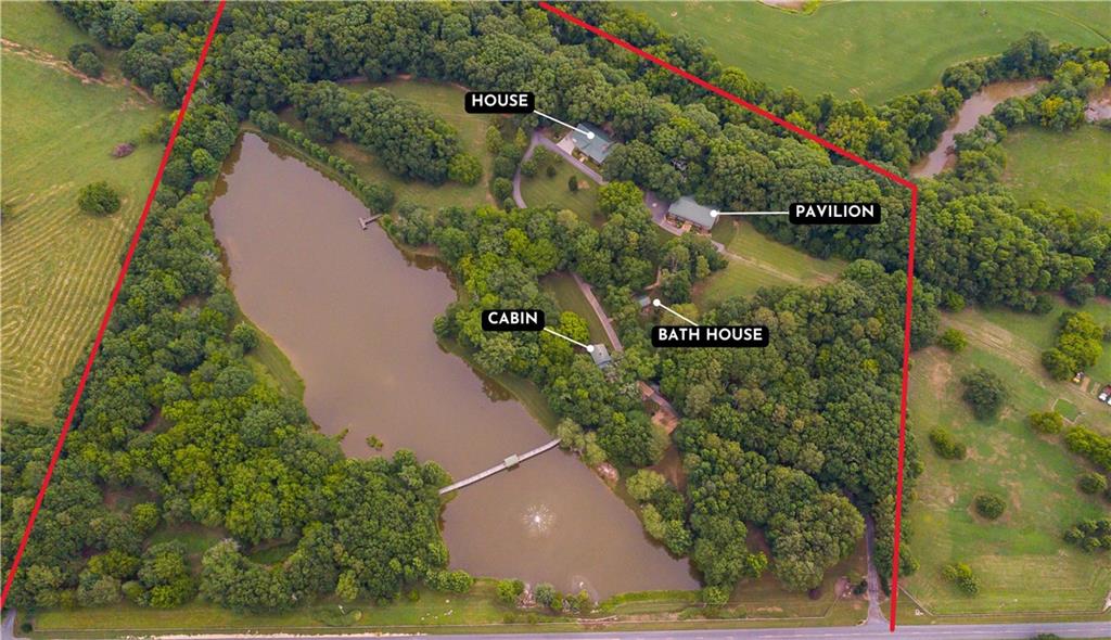 565 Owens Gin Road Northeast Calhoun, GA 30701 - Photo 11 of 80 an aerial view of a residential houses with outdoor space
