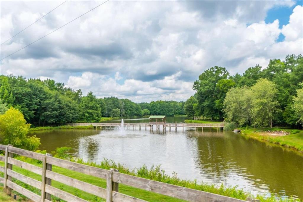 565 Owens Gin Road Northeast Calhoun, GA 30701 - Photo 28 of 80 a view of a lake with houses in the back