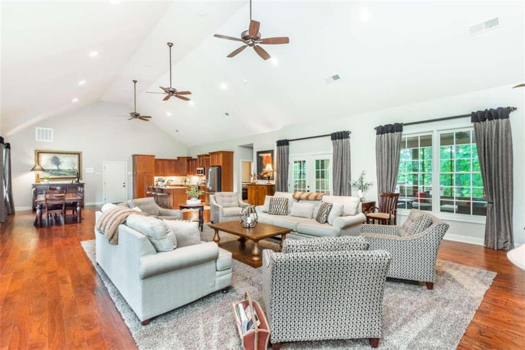 565 Owens Gin Road Northeast Calhoun, GA 30701 - Photo 41 of 80 a living room with furniture ceiling fan and a large window