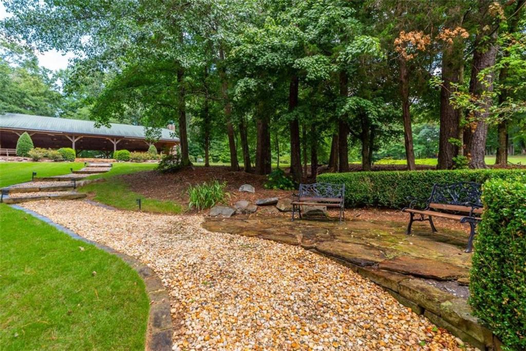 565 Owens Gin Road Northeast Calhoun, GA 30701 - Photo 63 of 80 a view of a backyard with large trees