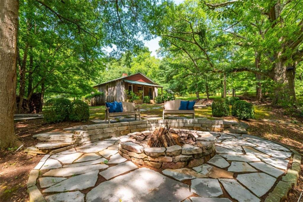 565 Owens Gin Road Northeast Calhoun, GA 30701 - Photo 74 of 80 a view of a house with backyard