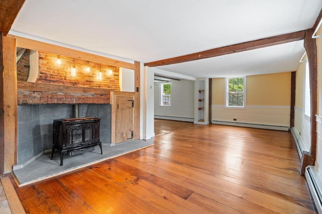132 Maple Avenue Atkinson, NH 03811 - Photo 11 of 41 a living room with furniture and a wooden floor