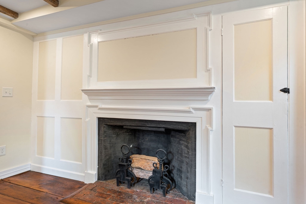 132 Maple Avenue Atkinson, NH 03811 - Photo 16 of 41 a living room with a fireplace and a window