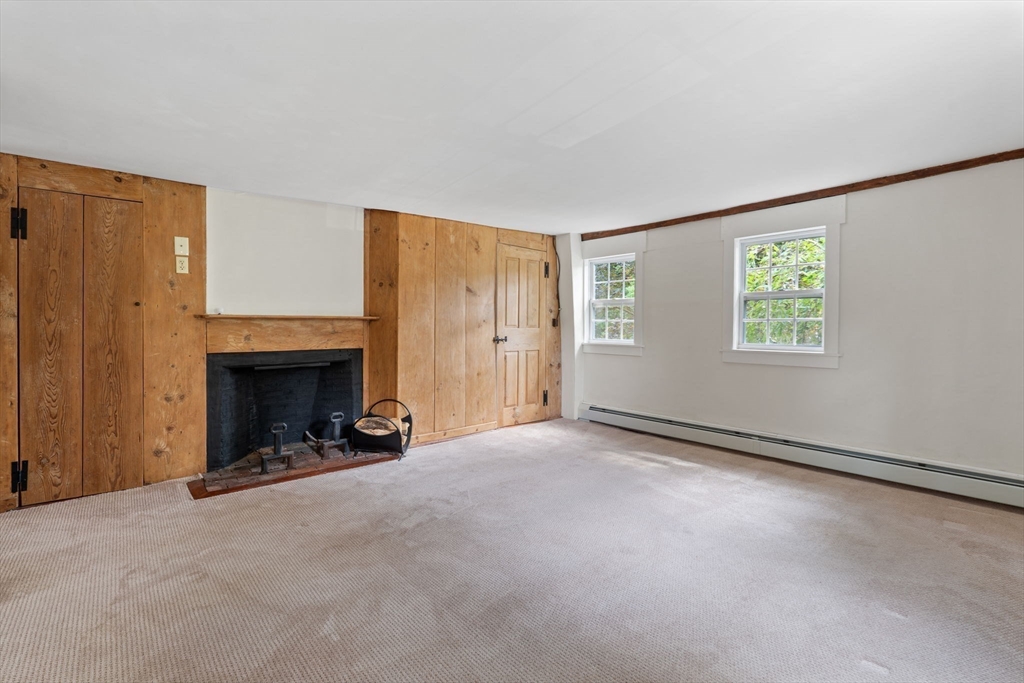 132 Maple Avenue Atkinson, NH 03811 - Photo 22 of 41 an empty room with windows and fireplace