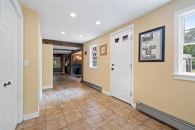 a view of hallway with window and hallway