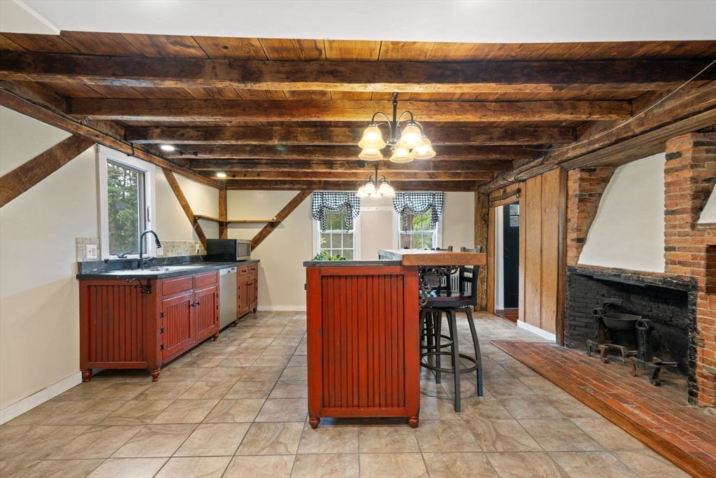132 Maple Avenue Atkinson, NH 03811 - Photo 6 of 41 a view of a kitchen with furniture and a kitchen