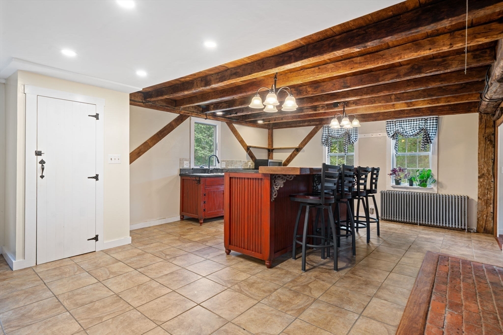 132 Maple Avenue Atkinson, NH 03811 - Photo 7 of 41 a view of a dining room with furniture window and outside view
