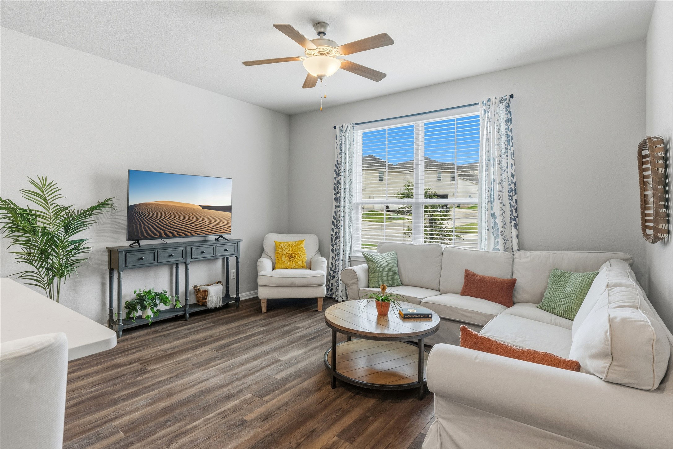 145 Beach Mountain Road Dripping Springs, TX 78620 - Photo 4 of 40 The spacious living room welcomes you with abundant natural light.