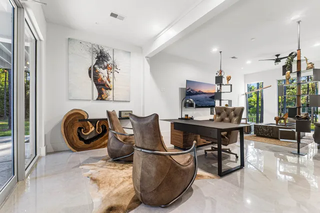 a living room with furniture and a large window