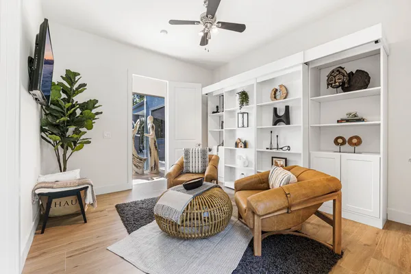 a bedroom with a bed and a potted plant