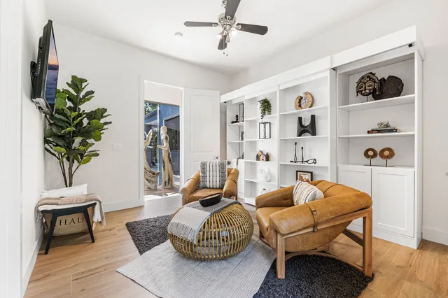 a bedroom with a bed and a potted plant