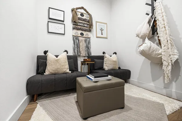 a view of storage and utility room with two washing machine