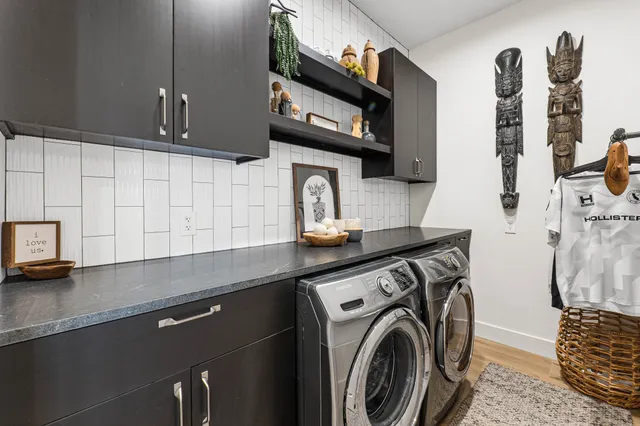 a work room with furniture and a large window
