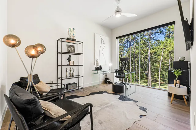 a view of a workspace with a table and chair in a room