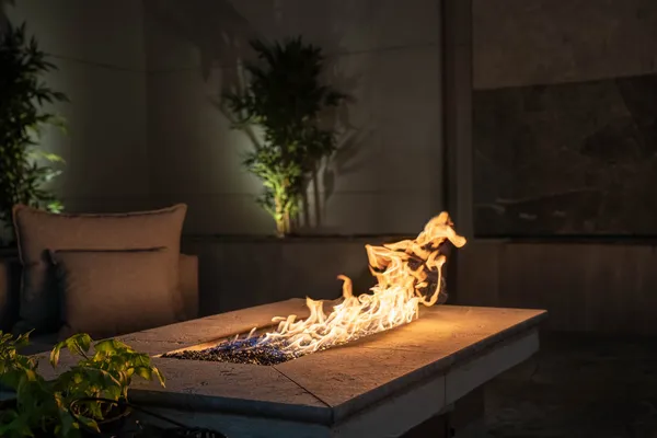 a room with lots of furniture and air hockey table