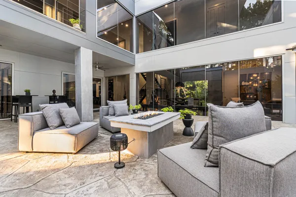 a view of living room kitchen with furniture and outdoor kitchen