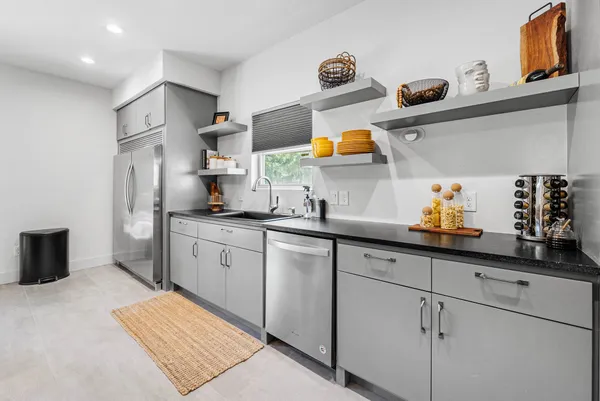 a bedroom with a bed and a potted plant