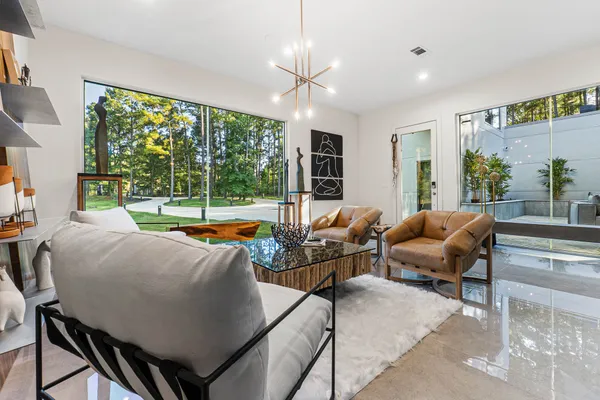 a view of a dining room with furniture and window