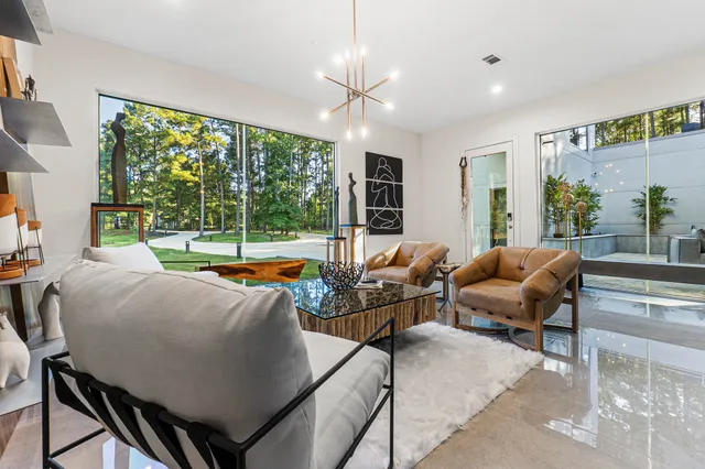 a view of a dining room with furniture and window