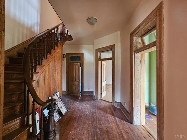 a view of an entryway with wooden floor