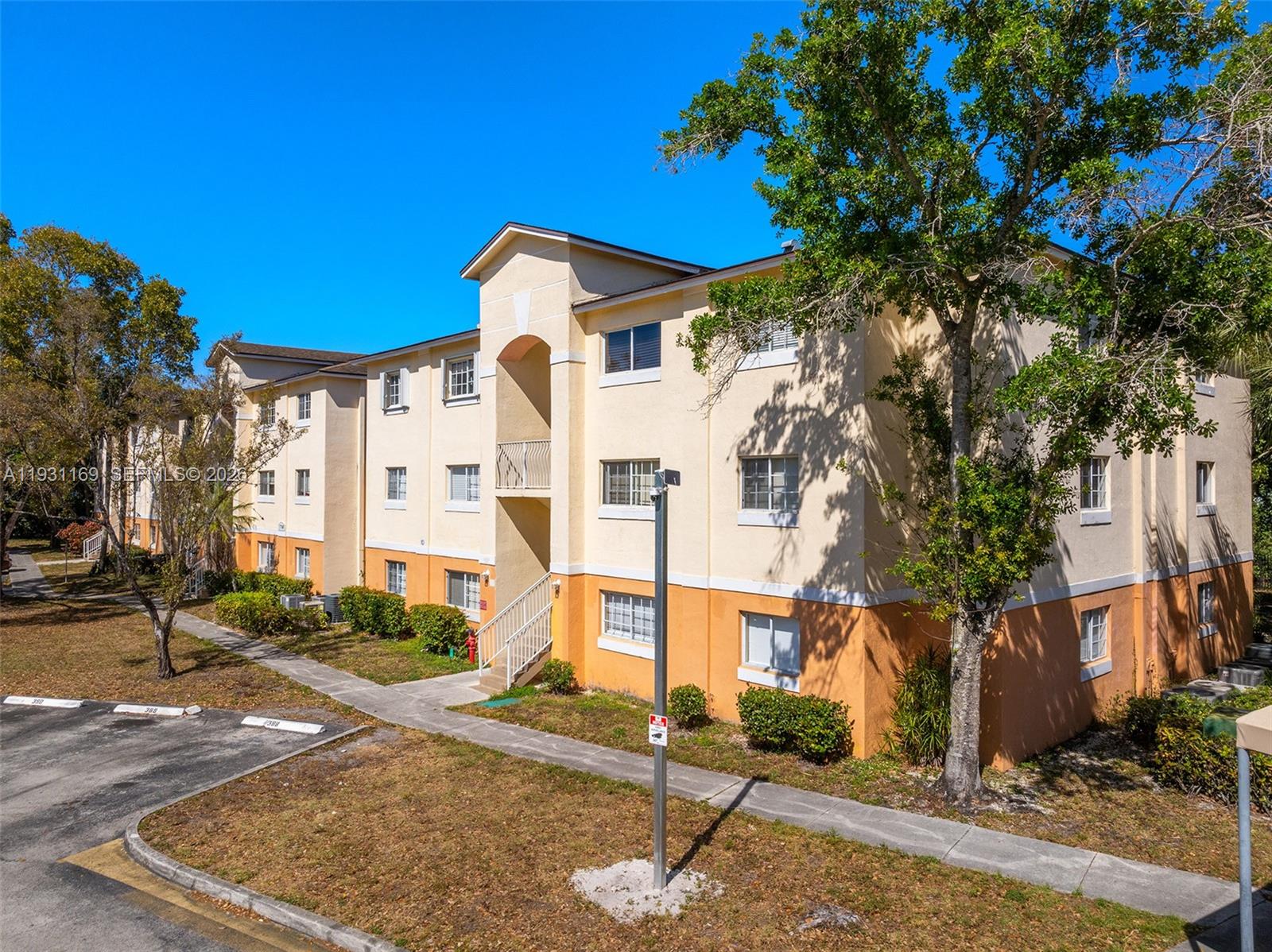 3700 North 56th Avenue, Unit 1012 Hollywood, FL 33021 - Photo 15 of 15 a front view of a house with a tree