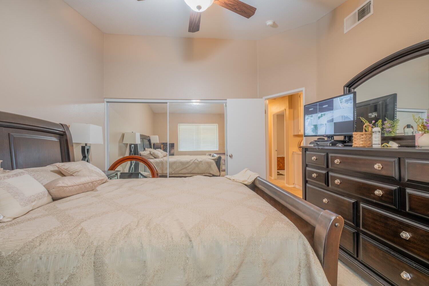 44628 Shadowcrest Drive Lancaster, CA 93536 - Photo 12 of 23 a bedroom with a bed and a dresser