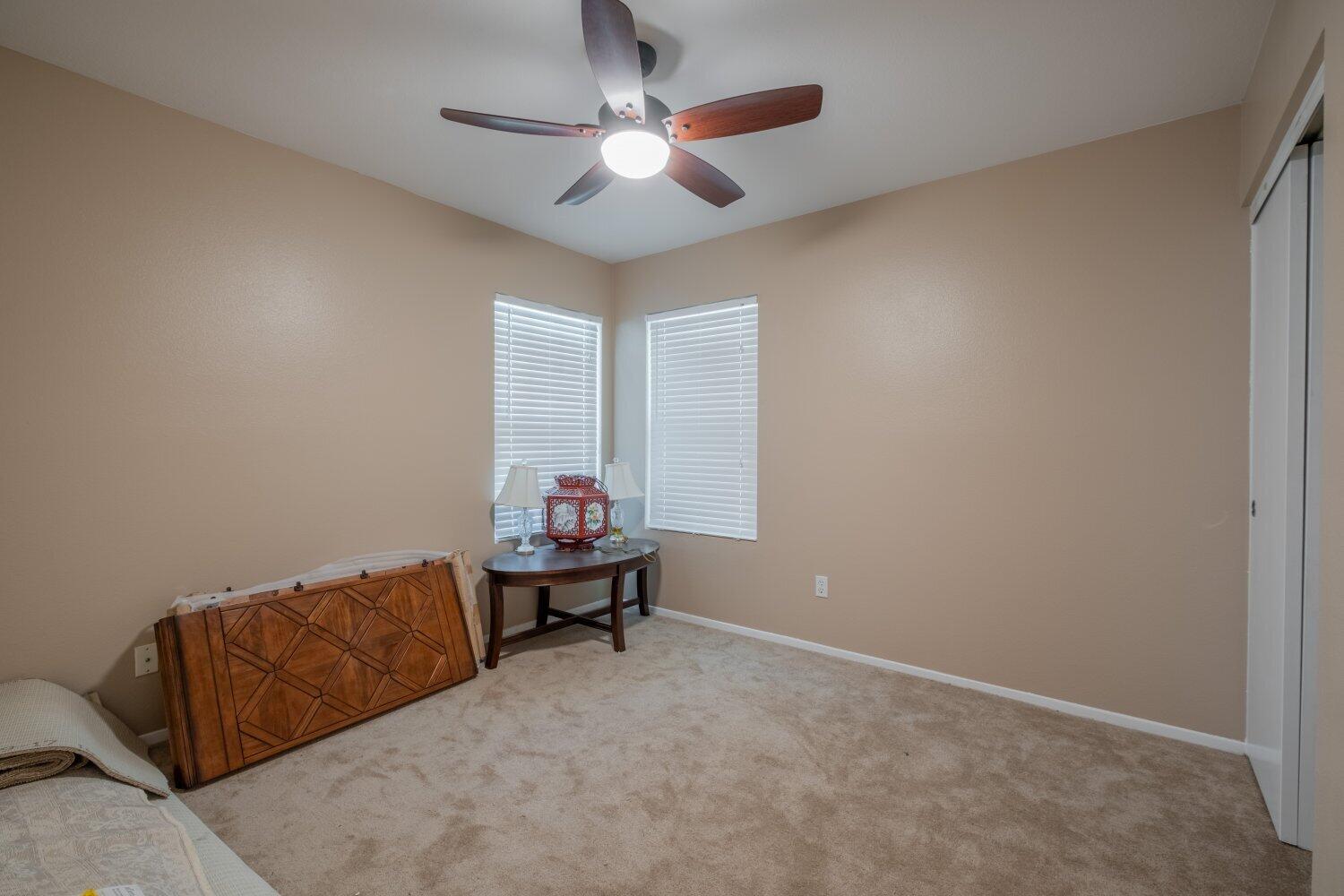 44628 Shadowcrest Drive Lancaster, CA 93536 - Photo 14 of 23 a living room with furniture and a ceiling fan
