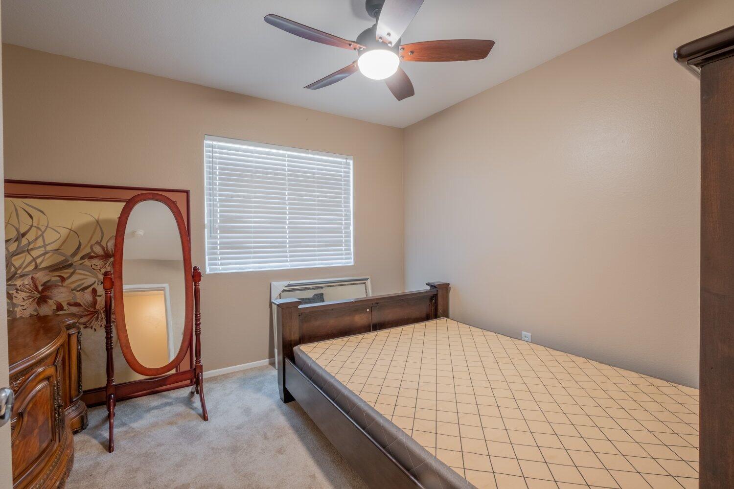 44628 Shadowcrest Drive Lancaster, CA 93536 - Photo 16 of 23 a bed sitting in a room next to a window