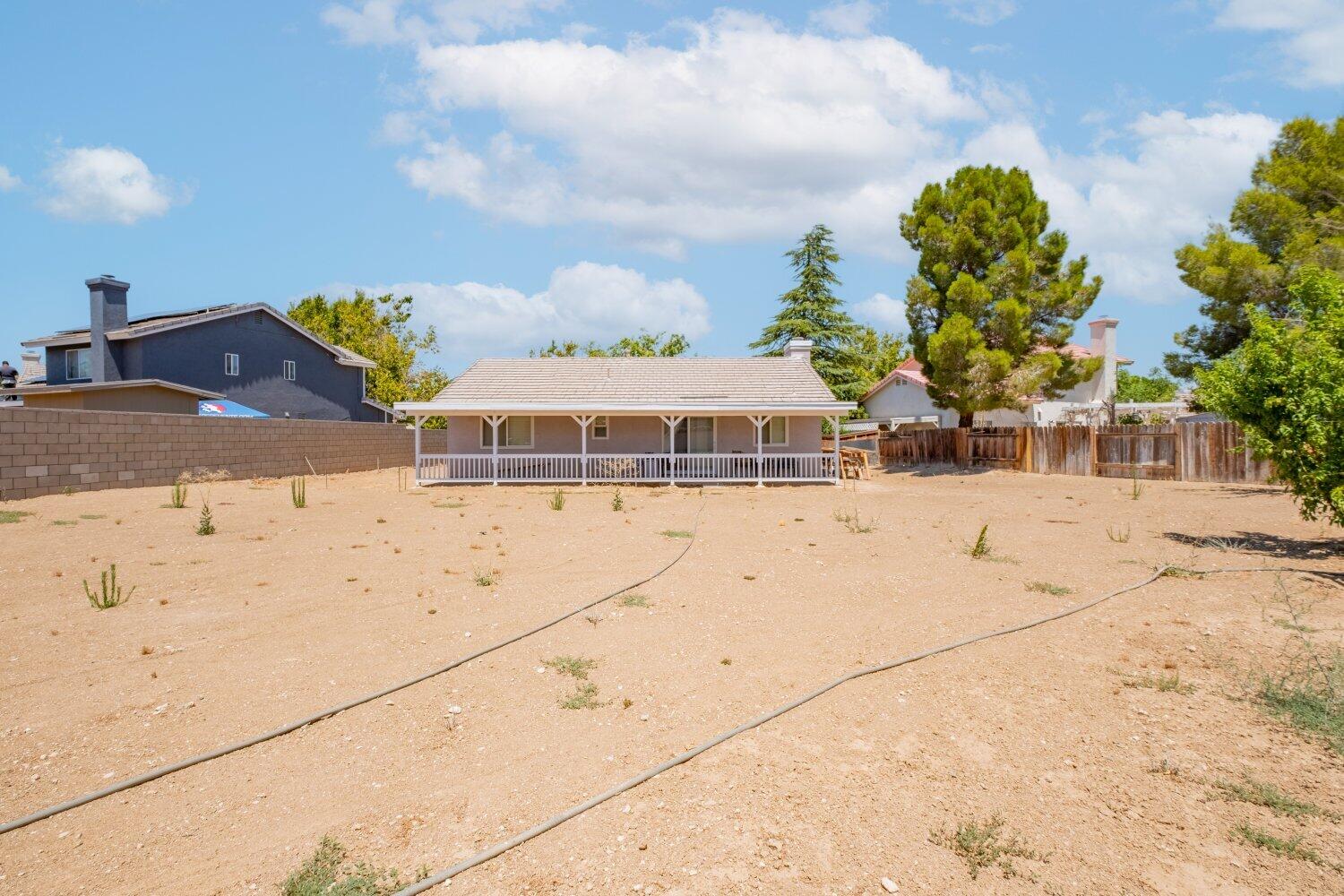 44628 Shadowcrest Drive Lancaster, CA 93536 - Photo 18 of 23 a front view of a house with a yard