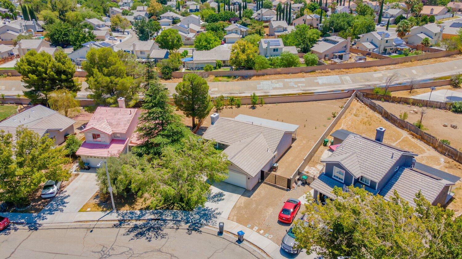 44628 Shadowcrest Drive Lancaster, CA 93536 - Photo 22 of 23 an aerial view of a house with a yard and lake view