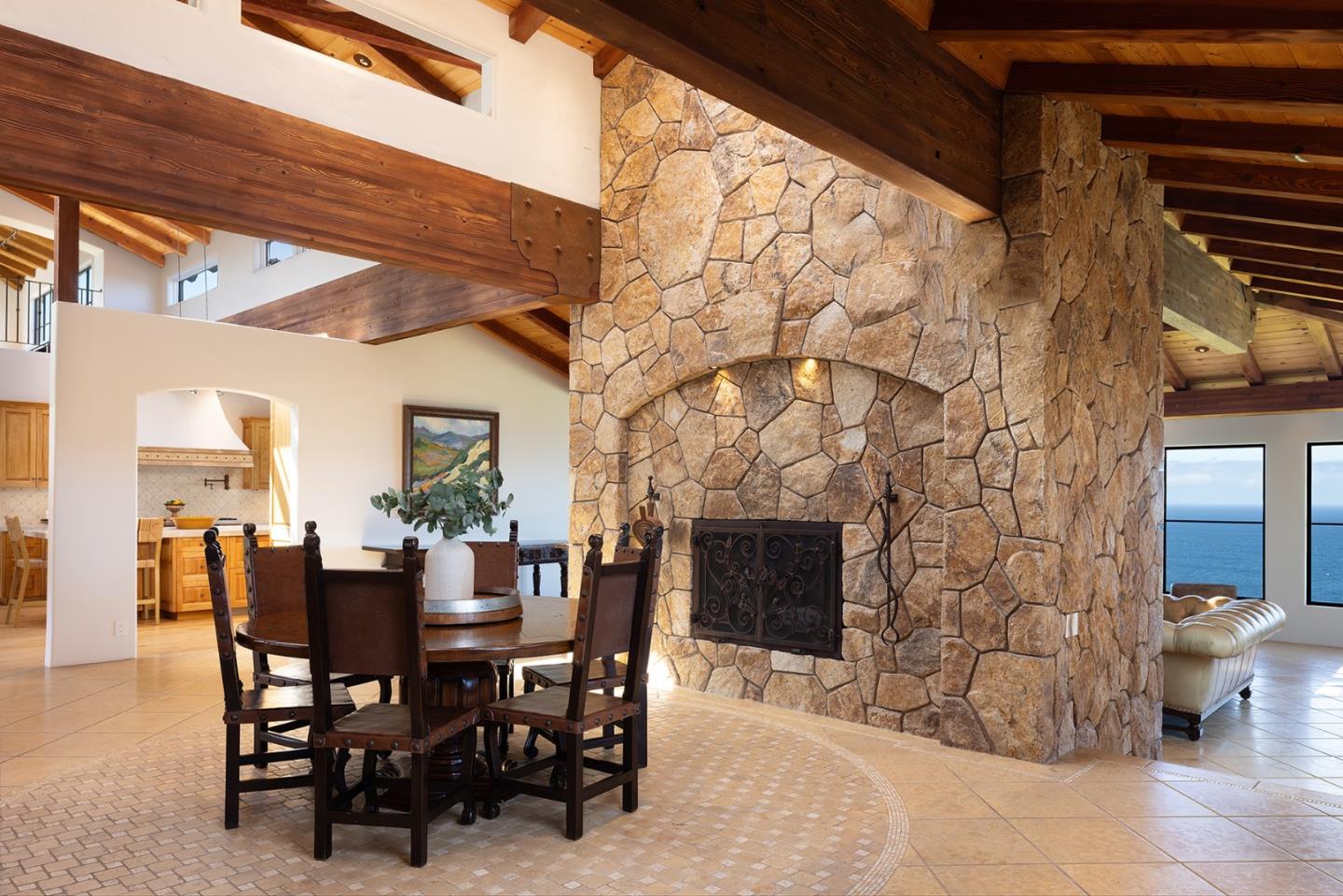 31453 Highway 1 Carmel, CA 93923 - Photo 11 of 58 a view of a dining room with furniture and wooden floor