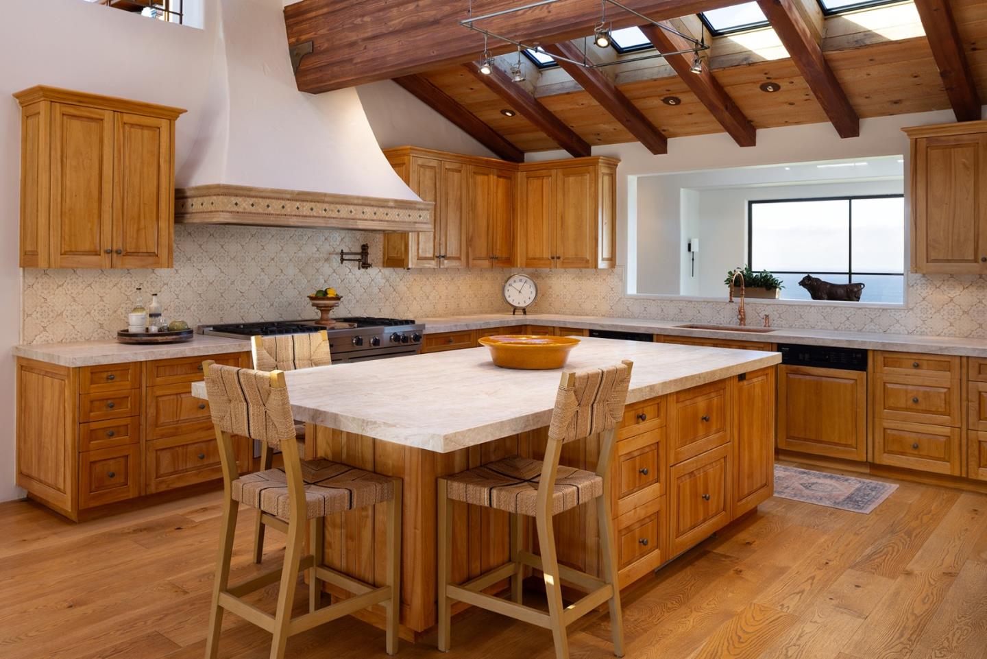 31453 Highway 1 Carmel, CA 93923 - Photo 12 of 58 a kitchen with a sink window and cabinets