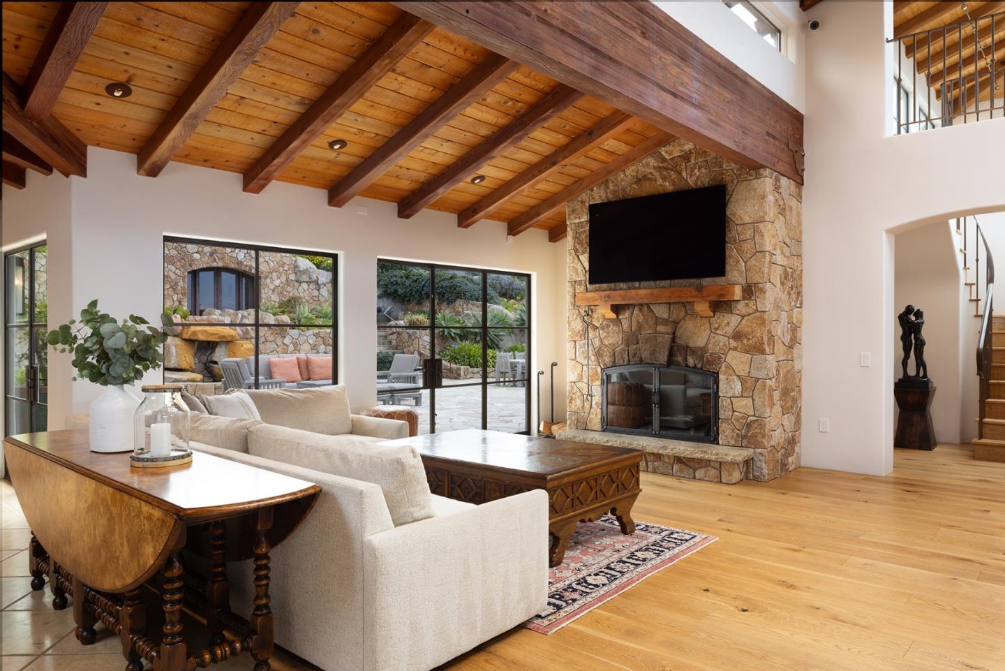 31453 Highway 1 Carmel, CA 93923 - Photo 15 of 58 a living room with fireplace furniture and a flat screen tv
