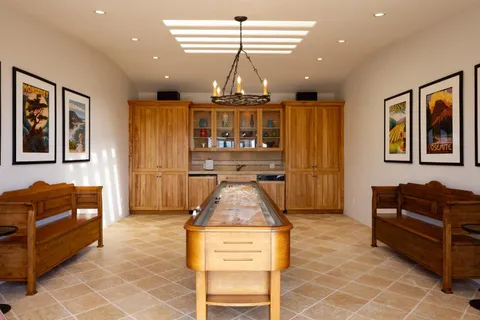 a view of a chairs and table in the balcony